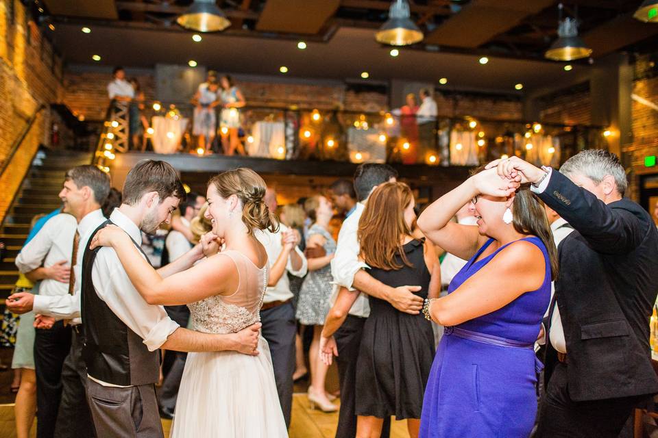 Couple and guests dancing