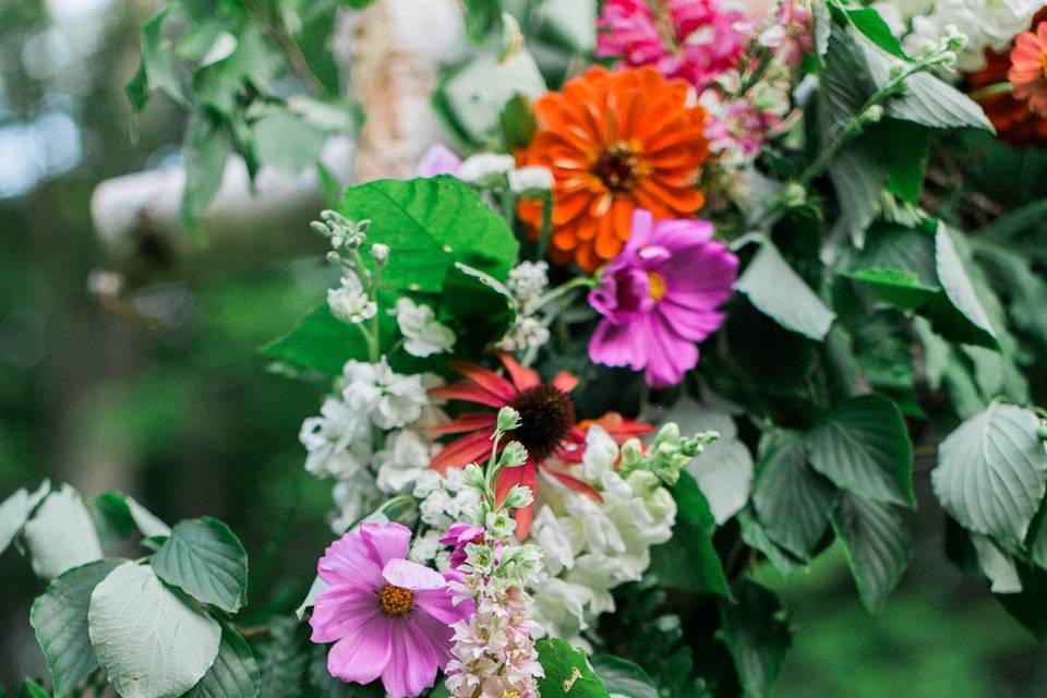 Create your own look by adding your flowers to the birch arbor