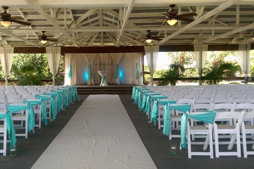 Ceremony space decorated with blue drapery