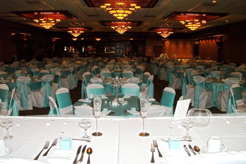 White reception setup with a touch of teal