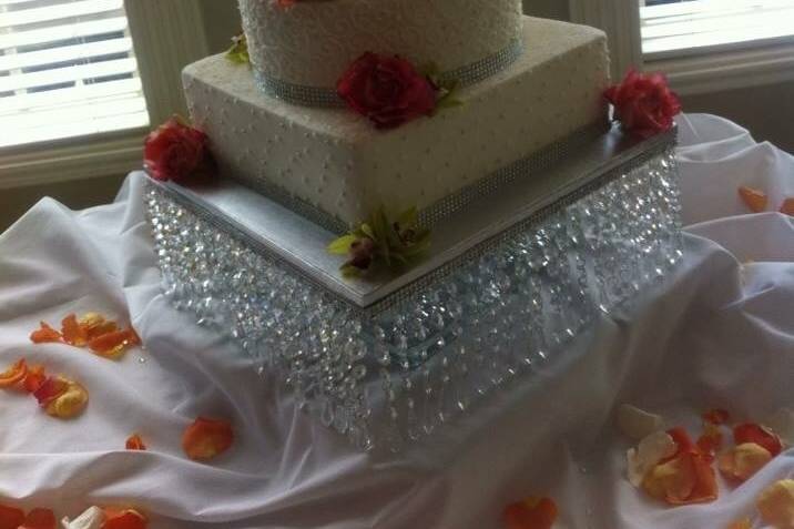 Four tier cake with red roses