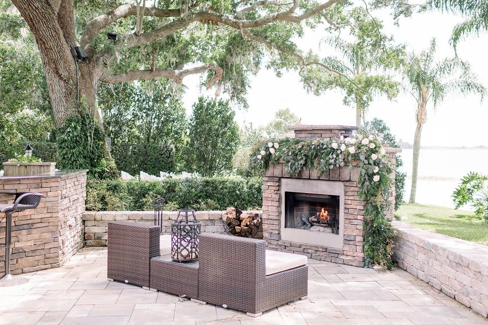 Lakeside terrace with fireplace