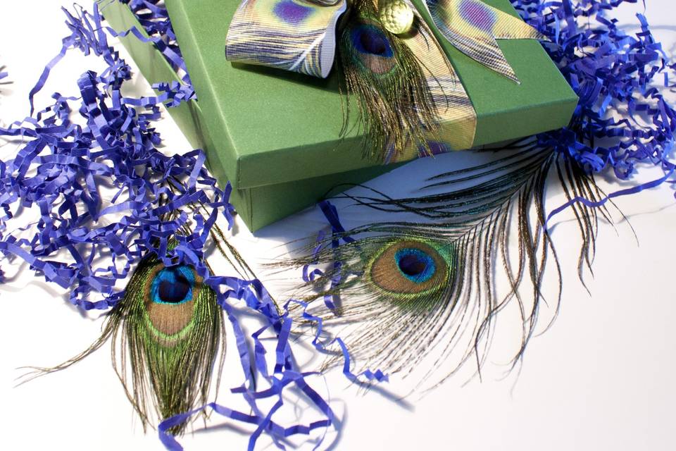 Custom Couture Musical Wedding Invitation - Peacock Theme is HOT right now. This invite features a box with peacock ribbon and green jeweled crystals, inside is contrasting shred and real peacock feathers. See other pictures for matching invitation suite.