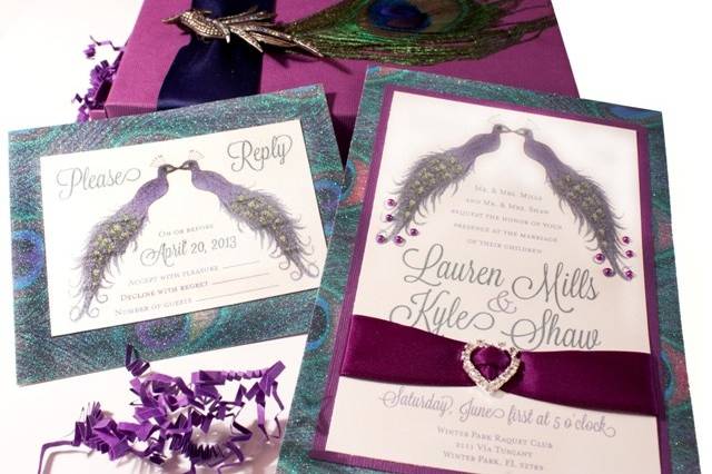 Peacock MUSICAL Wedding Invitation - incredible details on an original Peacock watercolor commissioned for the bride. The Kissing Peacocks have jeweled embellishments and the backing paper is a glitter peacock feather design. Invitation comes with ribbon and crystal buckle. The suite contains an RSVP card, return envelope, and decorated box with keepsake Peacock Pin and real peacock feather. Truly original one of a kind invitation that features MUSIC when opened. See alternative box picture as well.