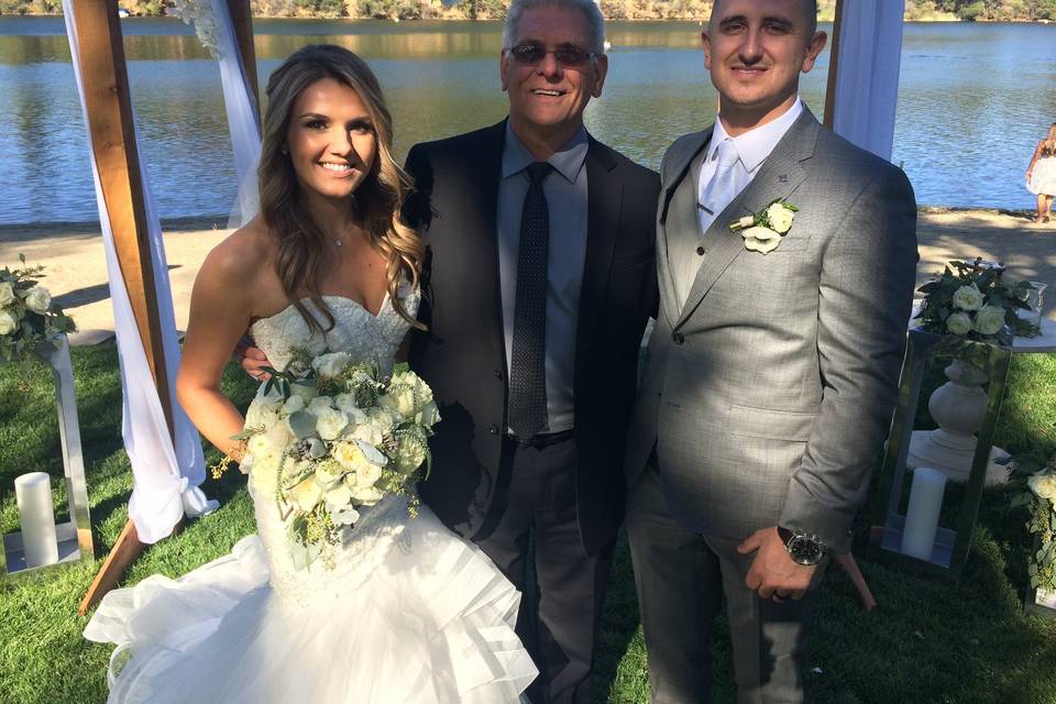 Newlyweds with the officiant