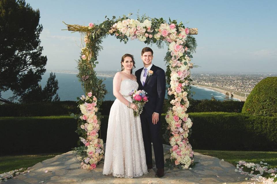 Pink and white ceremony arch