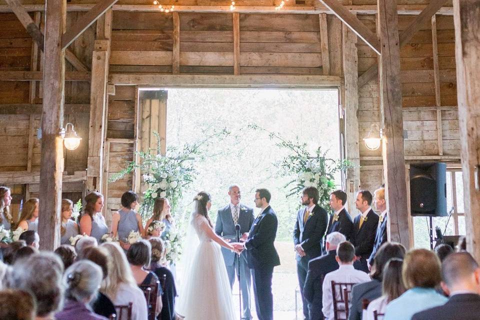 Ceremony inside of barn