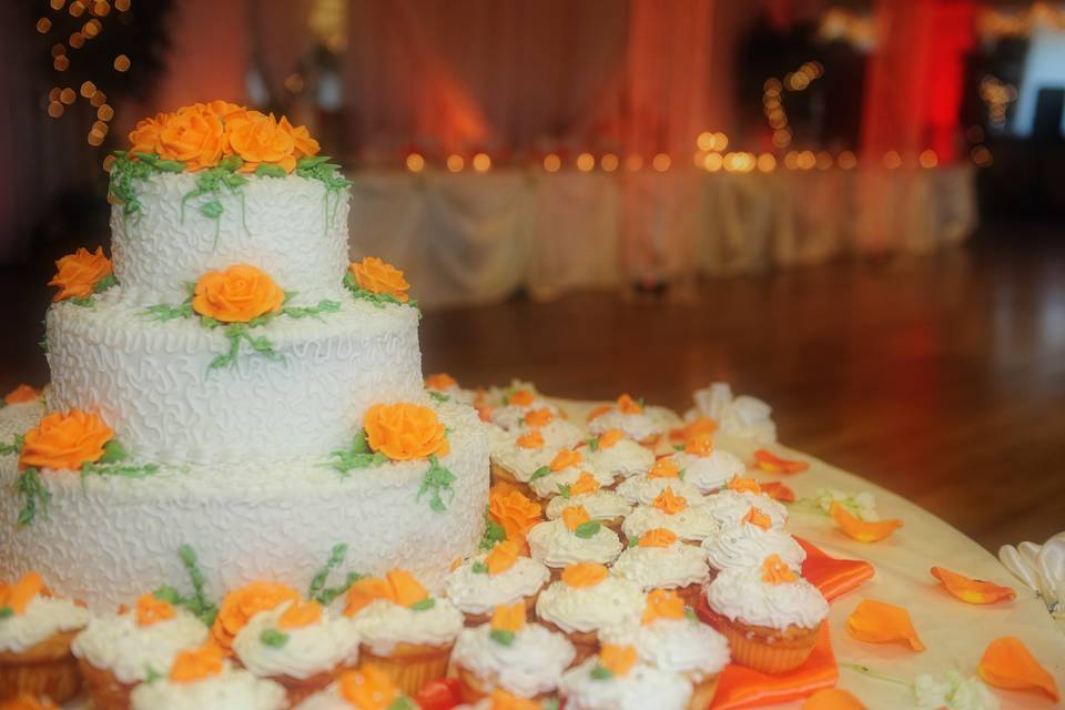 Wedding cake and cupcake table