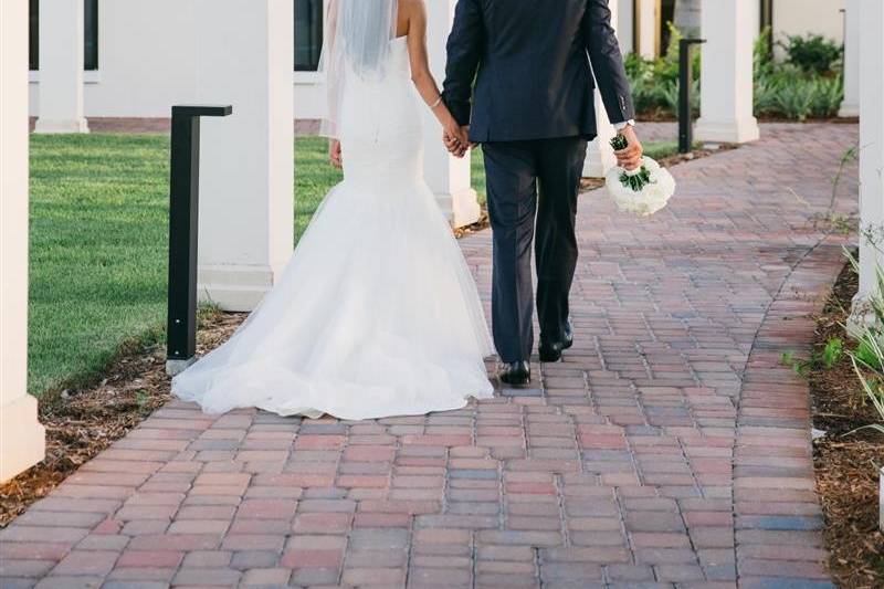 Couple leisurely walk hand in hand​