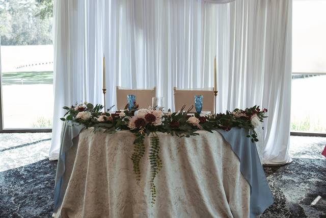 Sweetheart table and white drapery