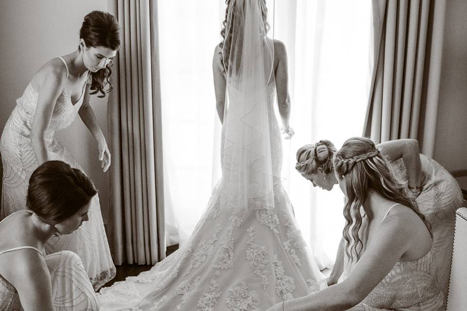 Bridesmaids admire the dress - Tim Otto Photography