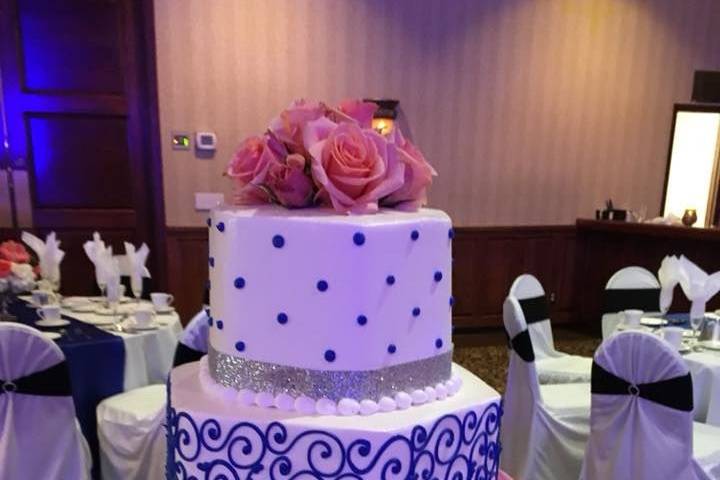Four-tier blue and white cake