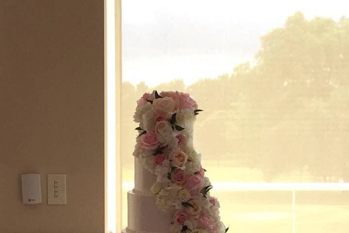 Five-tier flowing floral design cake