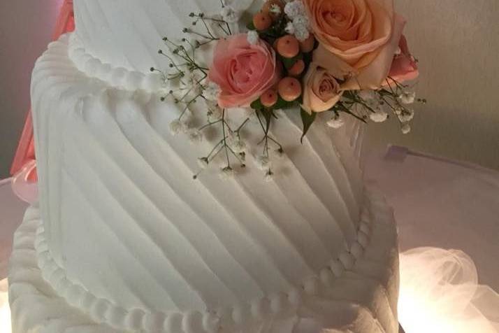 Three-tier floral arrangement cake