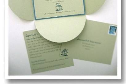 Custom square invitation with petal enclosure, postcard reply, and directions card.