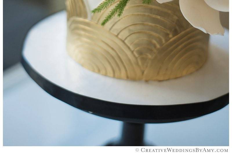 Mid-century design wedding cake top tier with 14k gold painted decor and sugar flowers