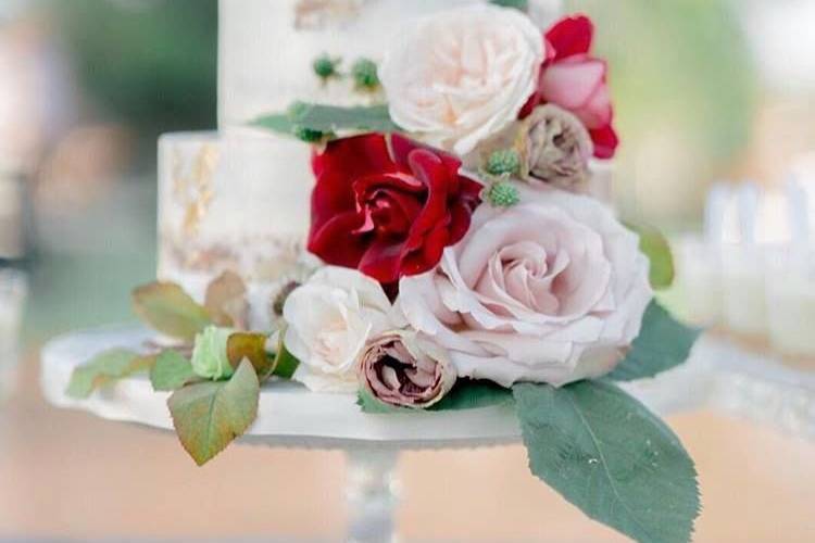 Petite, naked cake with fresh flowers