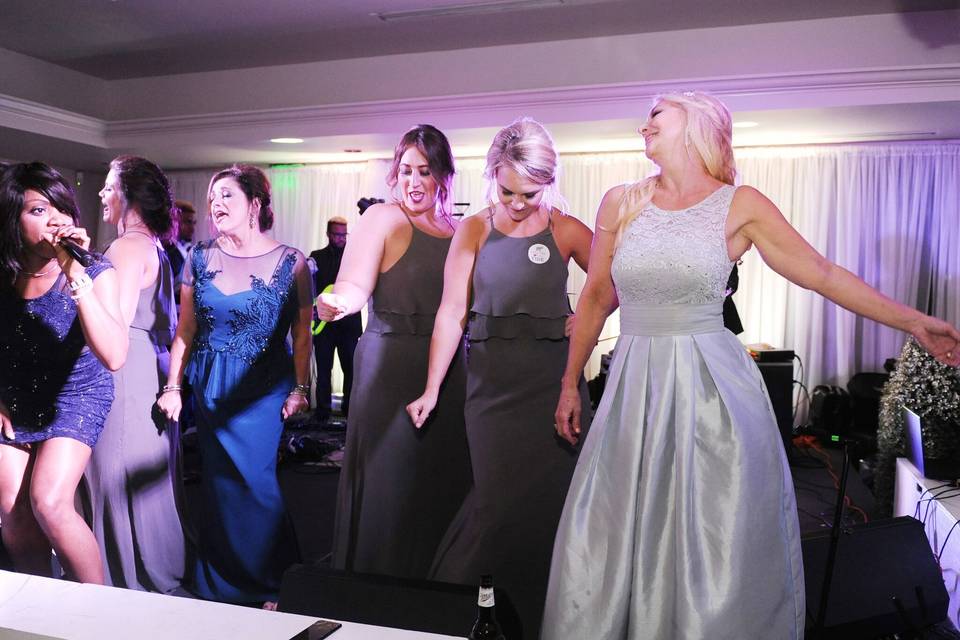 Bride dancing with her bridesmaids