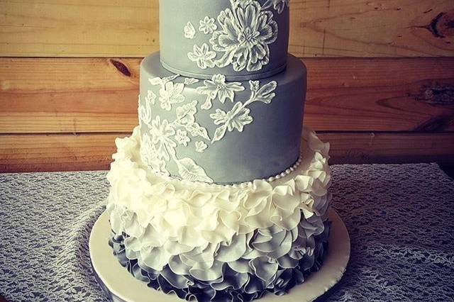 Blue wedding cake with white lace piping