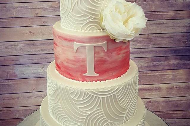 Square wedding cake with pink flower