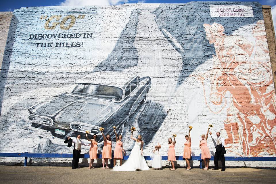 The couple with the bridesmaids and groomsmen