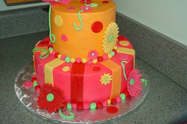 Birthday Cake: Buttercream accented with fondant flowers, stripes and dots.