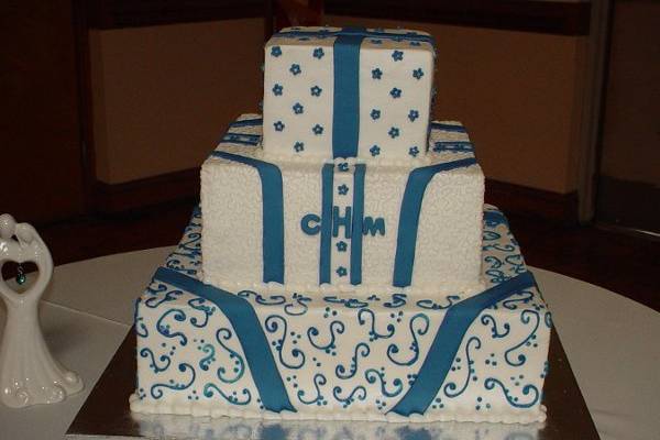 Three tier buttercream with fondant design. Reception held at Brunswick Shrine Club.