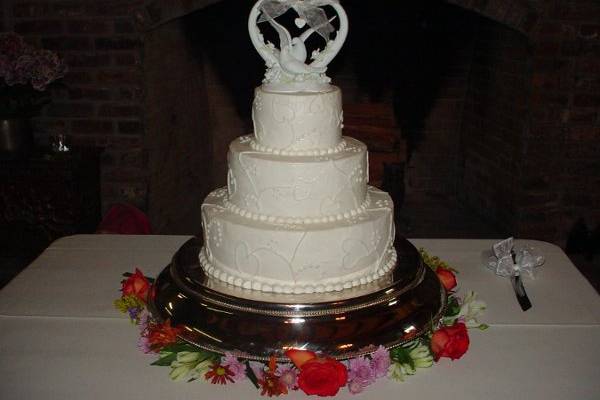 Three tier buttercream with heart design.