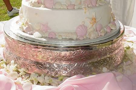 Three tier buttercream with pastel colored fondant shells, reception held at a cottage on St. Simons Island, Ga.