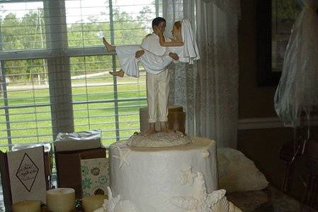 Three tier buttercream with fondant seashells. Jekyll Island, Georgia wedding on the beach.