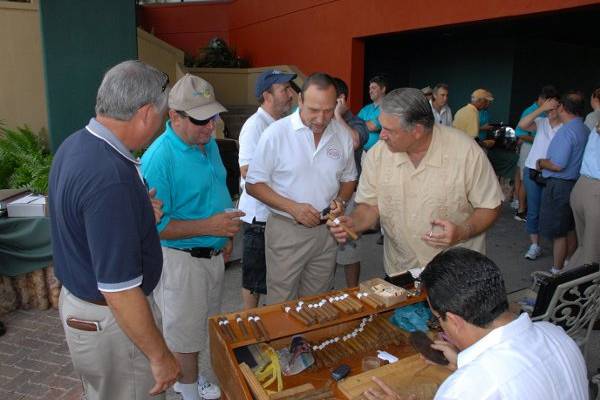 Frank Paul ... Presenting Cigars (Cut / Light) Present Cigars to Golfers at Jacaranda Country Club Golf Tournament ...