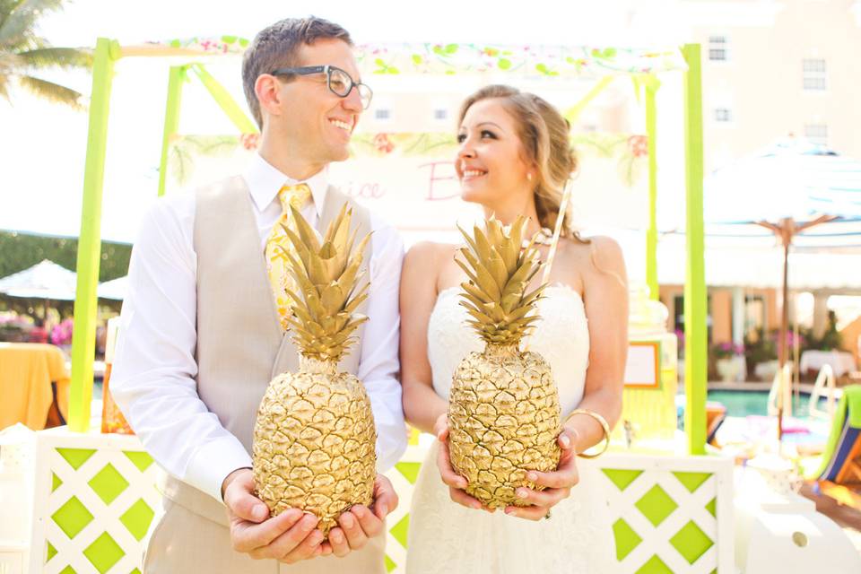 Couple holding pineapple