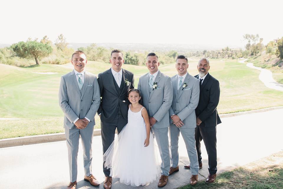 Groomsmen with flower girl