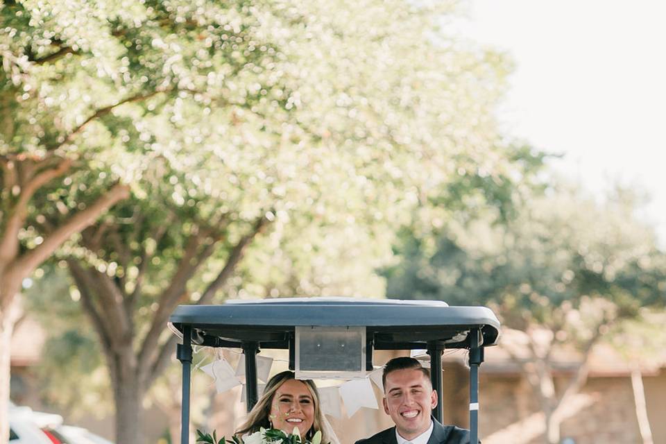 Bride & groom on the golf cart