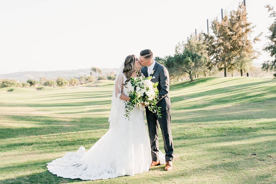 Bride and groom on the fairway