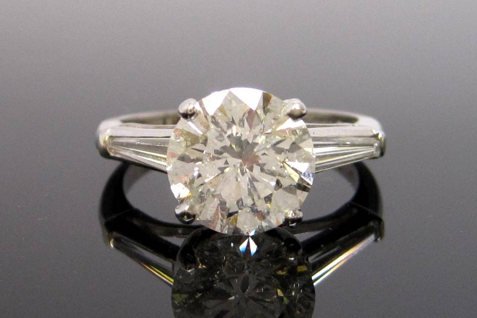 Lovely example of the classic Emerald cut diamond engagement ring. Shown is a certified 1+ carat stone. This ring is subject to prior sale