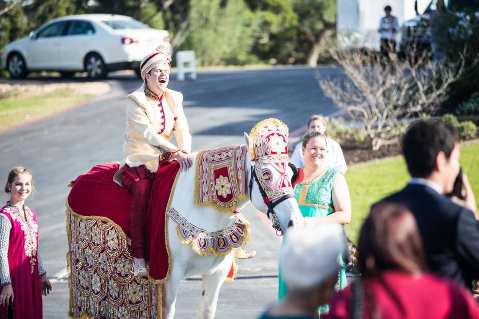 Groom riding a horse