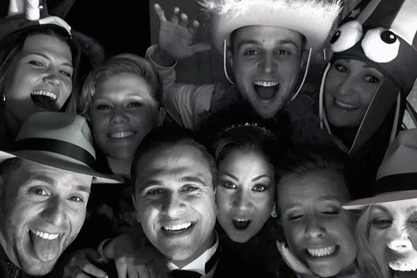 Although our record is 12 people in our photo booth enclosure that all made it into the photo, there's still our bride & groom in there having a blast with 7 of their friends and getting goofy! :)
-DJ Geoff