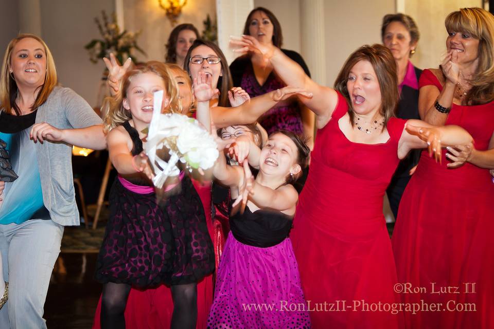 Catching the bouquet is potentially a great action shot!