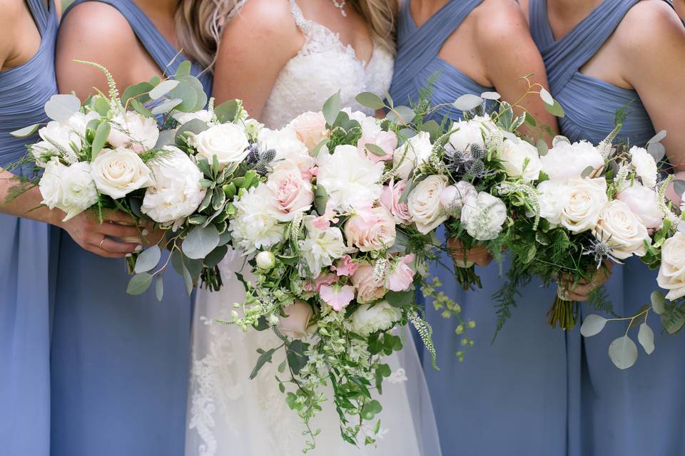 The wedding party with bouquets