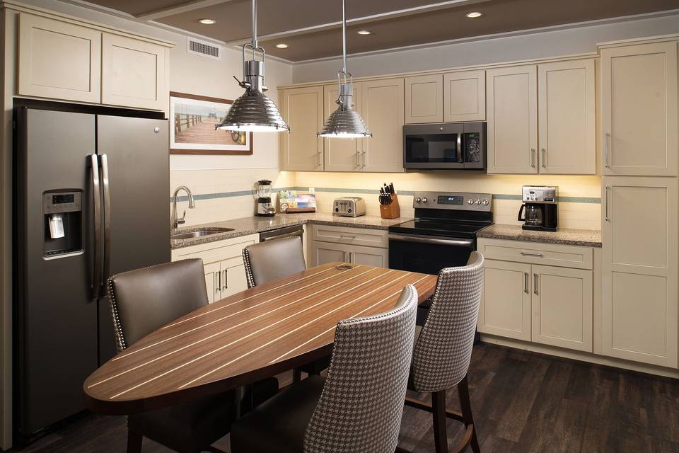 Full-gourmet kitchen and dining area of two-bedroom suite