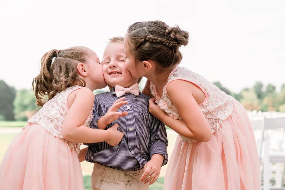 Flower girls kiss ring bearer
