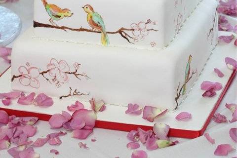 hand painted birds and branches to match the  brides china pattern.