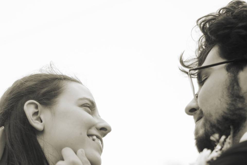 Groom touching bride's face