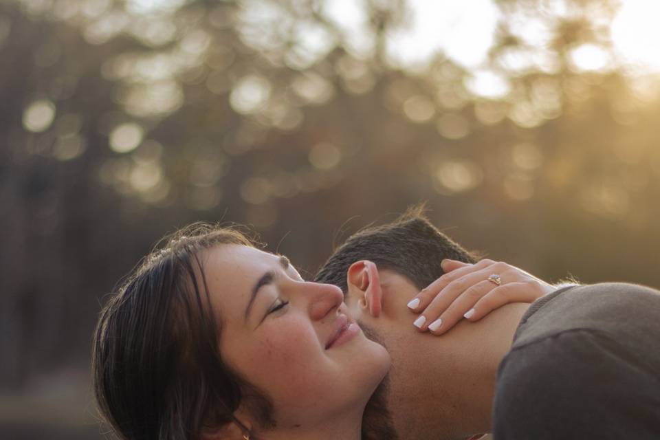 Man dipping his fiancee