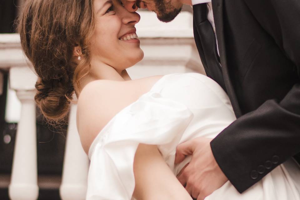 Groom dipping bride