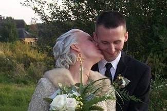 Bride kissing her groom