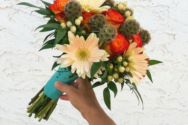 Teal and orange bridal bouquet with pods
