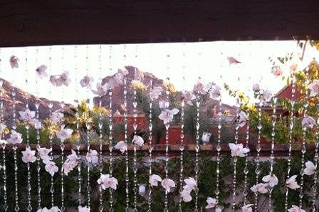 Tropical orchids adorn this wedding arch in Scottsdale, AZ