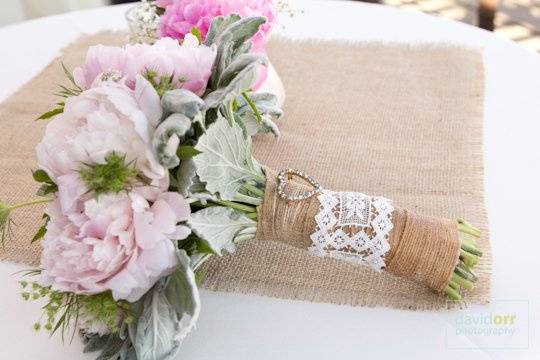 A shabby chic bridal bouquet with burlap and lace